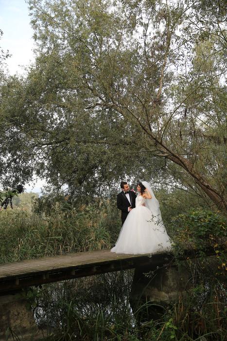 a beautiful couple at a wedding in the park