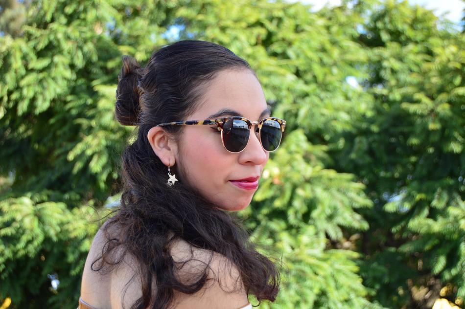 girl in sunglasses in nature on a blurred background
