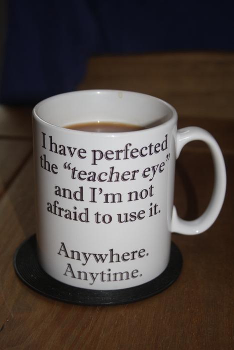 white mug with a signature