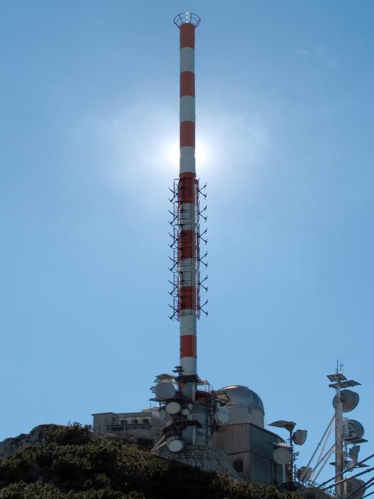 blue sky in sunlight with a tower