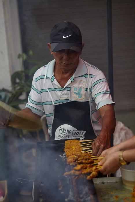 man in the cap is cooking
