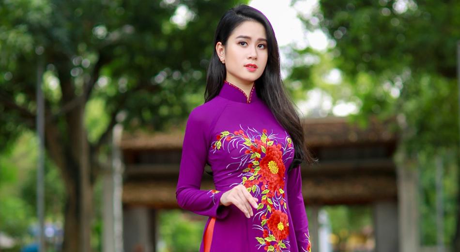 beautiful asian woman in a colorful suit on a blurred background