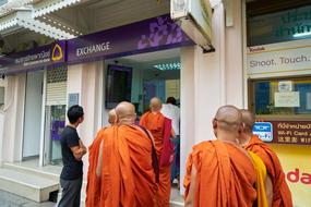 monks walking the stores