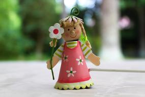 Girl with Braids and Flower figure