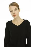 young woman in black on white background
