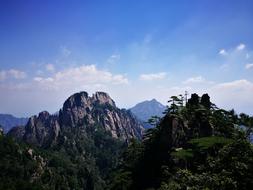 the mountains with the rocks and the trees are gorgeous
