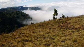 landscape of mountains peaks reach the clouds