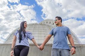 young people walk by the hand