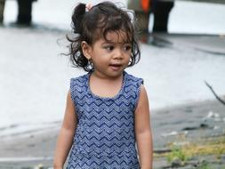 photo of a cute girl in a blue dress