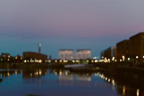 blurred reflection of the night city in the river