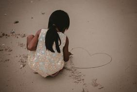 drawings on wet sand on the beach