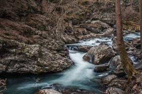 long waterfall by the rocks