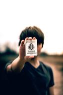 Guy showing game card