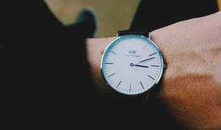 Close-up of the beautiful, shiny wrist watch, on the hand of a man