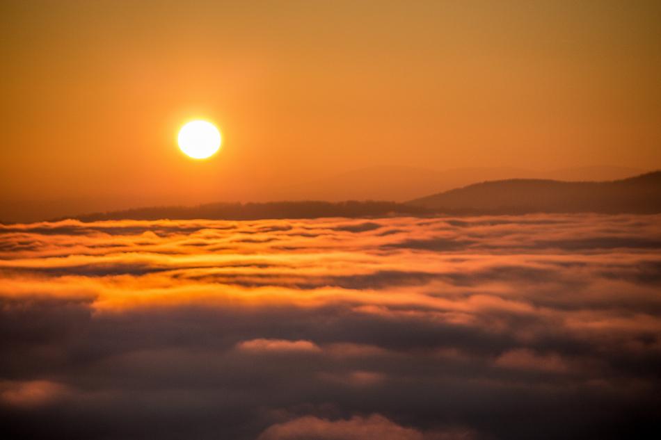 baking sun in a cloudy sky