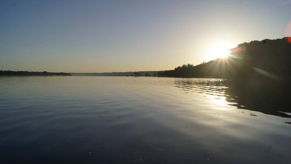 bright sun over the lake landscape