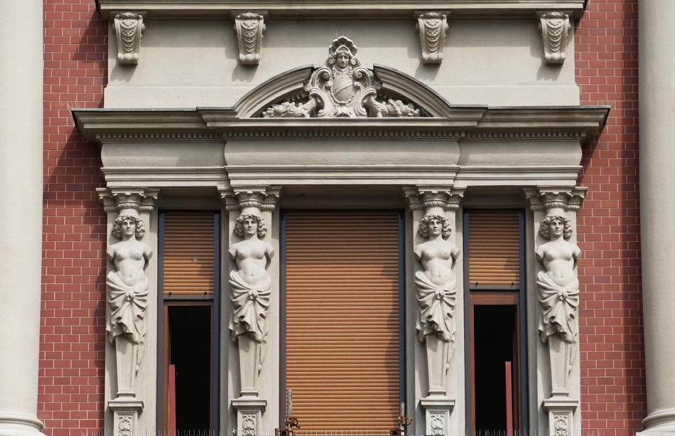 statues of women on the facade of a museum in Belgrade, Serbia