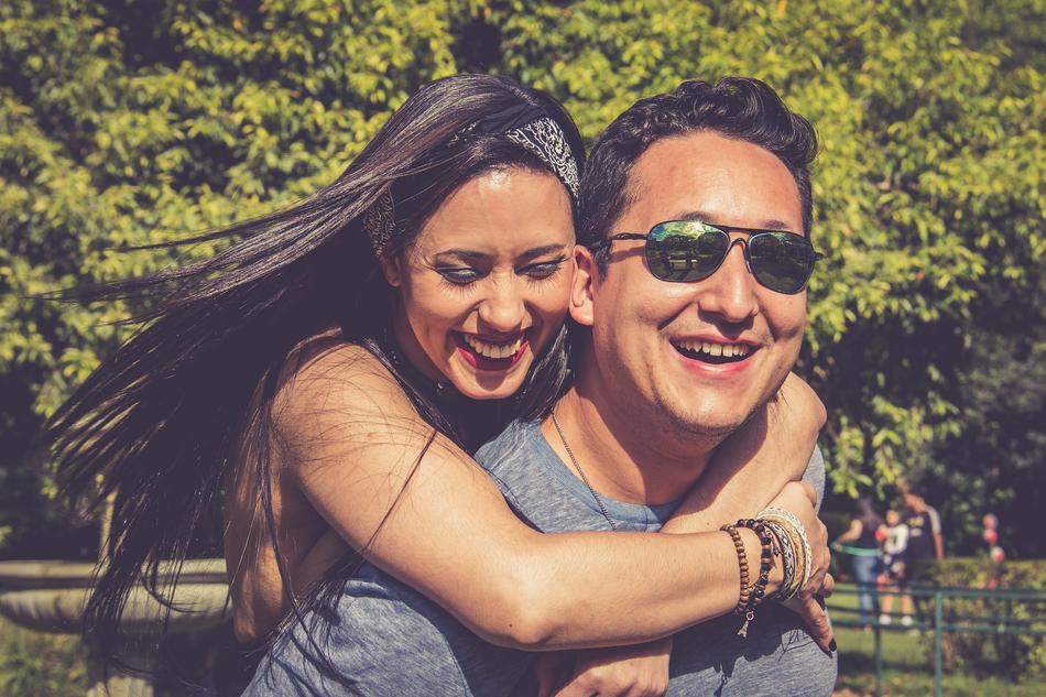 happy lovers in a city park on a sunny day