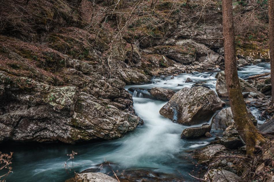long waterfall by the rocks
