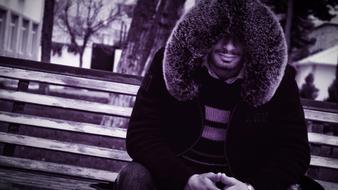 photo of a man in a hood with fur