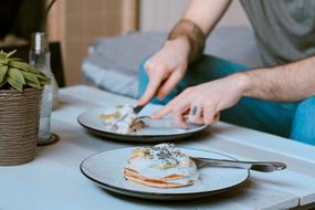 man at the table with breakfast