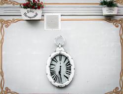 white clock on the wall landscape