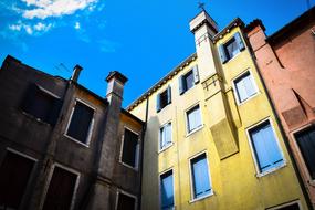 colorful building facades, blue sky