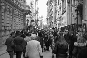 black and white photo of people on city streets