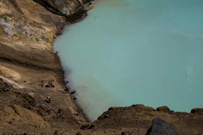 women swim near the coast near the rocks