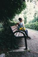 Girl Sitting garden with flowers