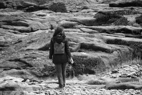 child Girl on walking on rocks, Black And White