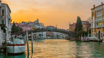 Yacht on channel at dusk, italy, venecia