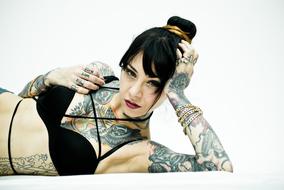 girl with tattoos in black bikini