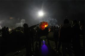 photo of people at a party in the dark