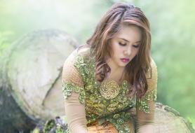 a girl in an unusual green dress