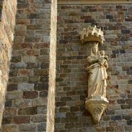 statue of the Holy Virgin on the facade of the church