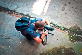 photographer with camera in a lost place