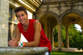 smiling guy among historical architecture