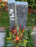 a grave with beautiful flowers