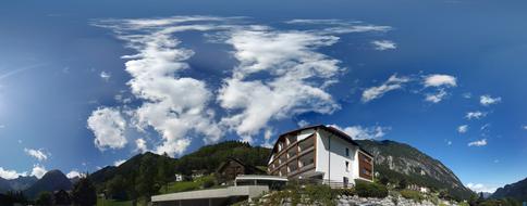 clouds in the blue sky with houses