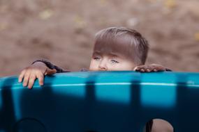 photo of blond boy climb