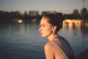 photo portrait of a calm pensive girl on the embankment