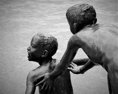 Black and white photo of the children, playing in Singapore