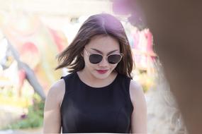 Beautiful, Asian girl with the sunglasses, outdoors