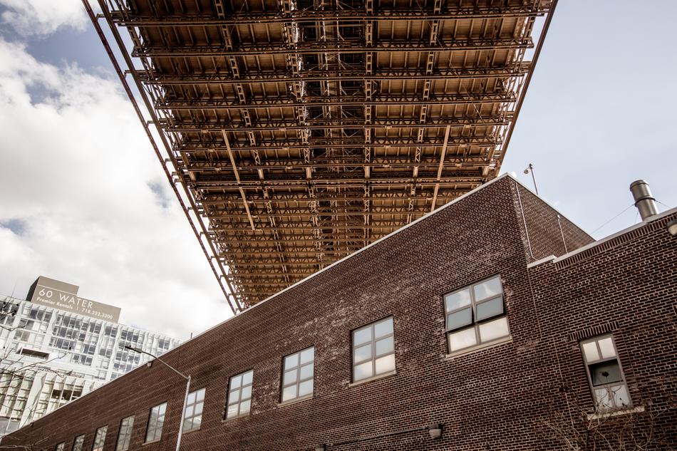 brick building under the bridge