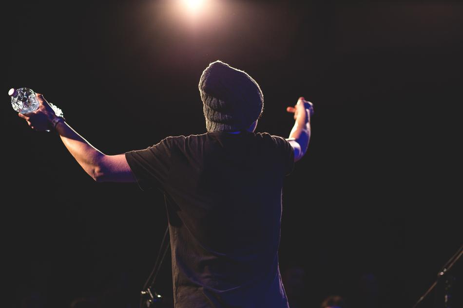 Guy with bottle on the stage