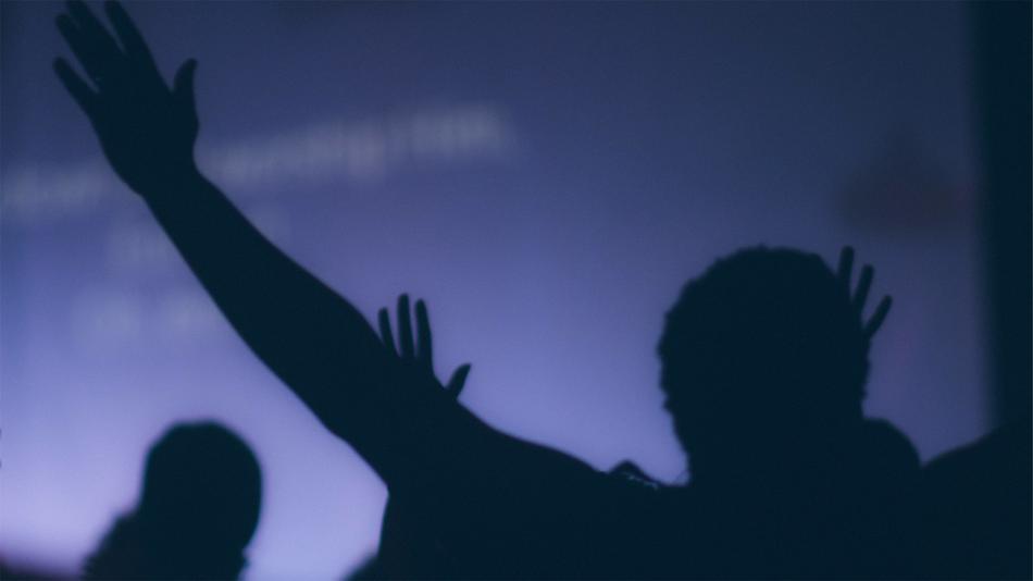 Silhouette of People with Hands Up, blur background