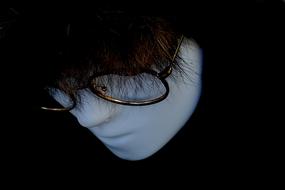 white mannequin face with glasses with wig