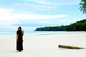Kei Islands person sand