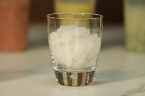 glass with ice in a glass